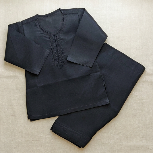 Black baby kameez shalwar flat lay