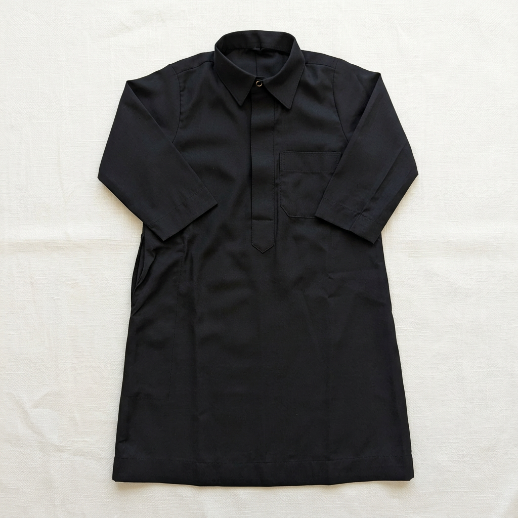 Black baby thobe flat lay