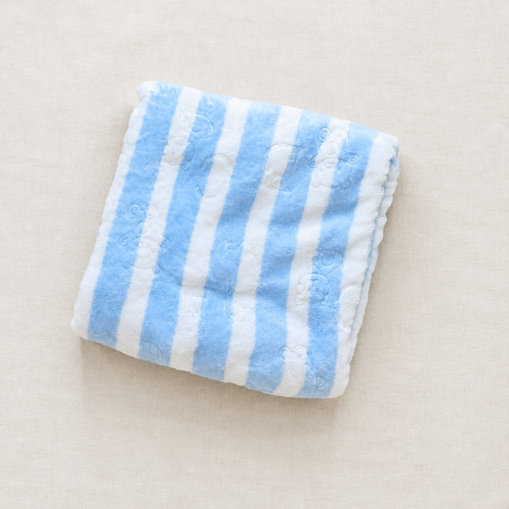 Blue striped winter blanket flat lay