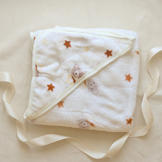 Cream bear-and-stars blanket gift styling