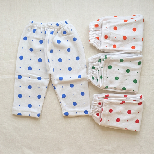 Four big-dot pajamas flat lay