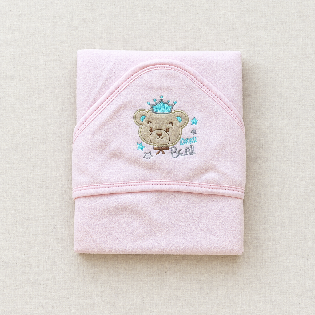 Pink bear and crown blanket flat lay