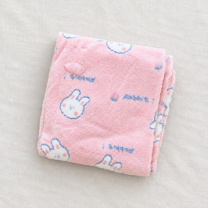 Pink bunny blanket flat lay