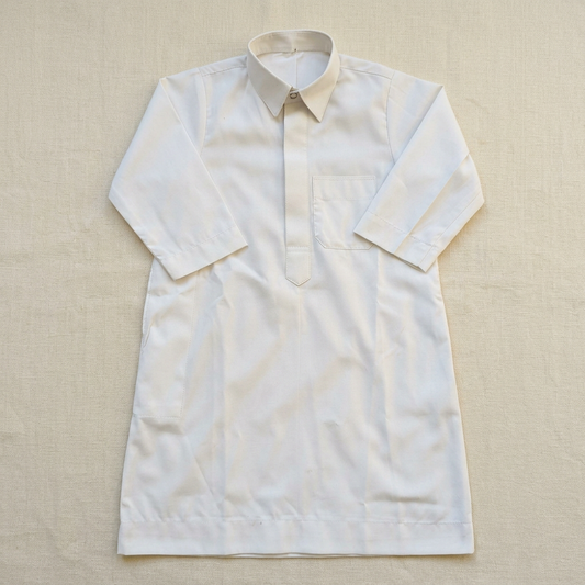 White baby thobe flat lay