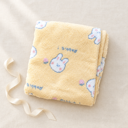 Yellow bunny blanket gift styling