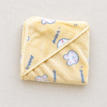 Yellow rabbit hooded blanket flat lay